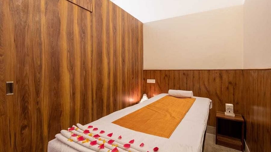 Image of a spa bed with candles on the table  | DLS Serenity Resort and Spa